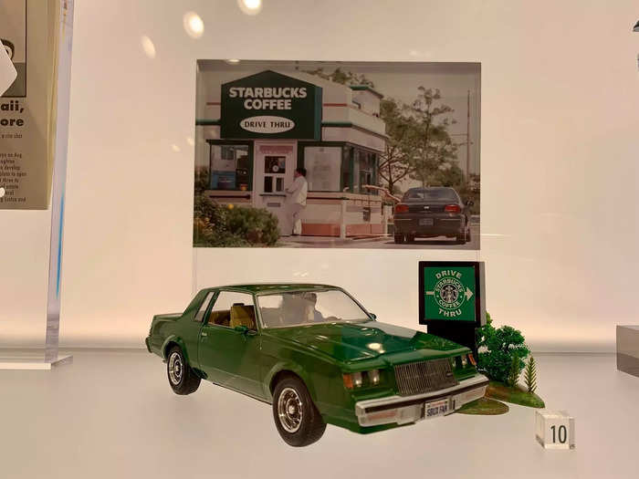 A miniature car commemorates the first Starbucks drive-thru in 1994. Drive-thrus are now key to Starbucks