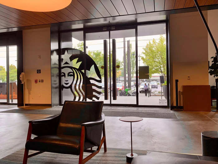 The lobby was set up for visitors to wait in, and reminded me of a Starbucks store with seats, tables, and warm lighting.