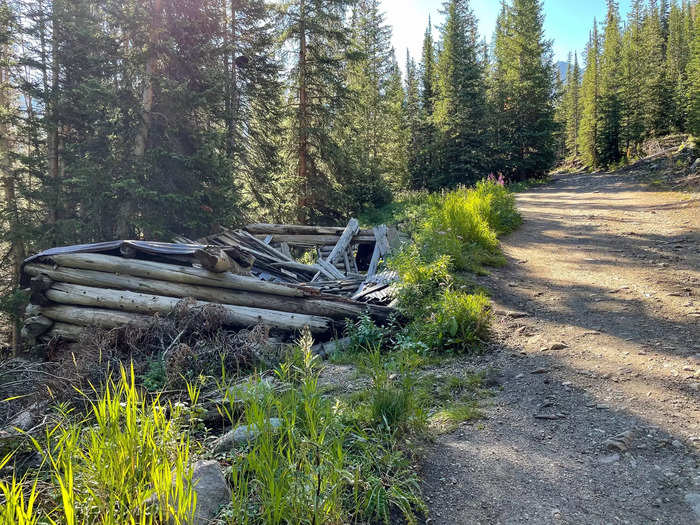 As I hiked up the wide, rocky path through spur and fir trees, I spotted my first sign of the region