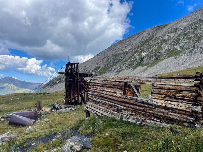 The abandoned buildings make up the Boston Mine ghost town, which sits in the V-shaped valley of the Mayflower Gulch.