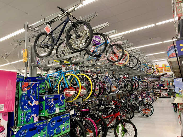 The far side of the store is dedicated to outdoor items, like bicycles and fishing poles.