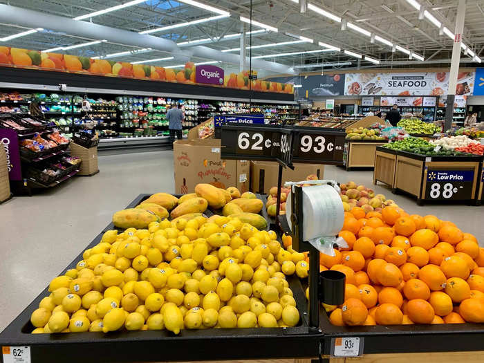 Most fruits and vegetables are displayed in huge piles with clearly marked prices.