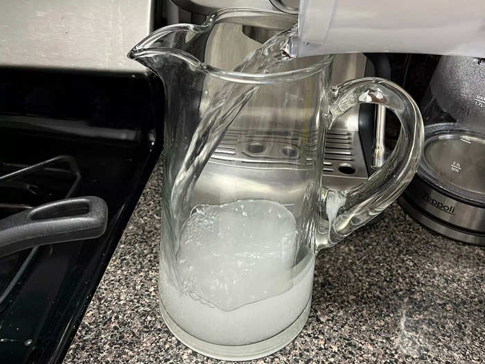 Once you add your desired amount of sugar, add about a quart of cool water to the pitcher and stir.