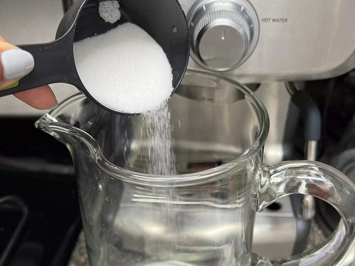 While the tea simmers, add 1/4 cup of sugar to your pitcher.