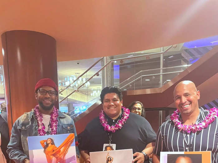 Family members bring signs to show their support for the contestants.