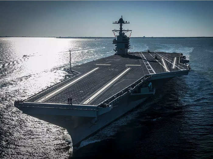 View of the empty flight deck of the USS Gerald R. Ford. The ship can hold around 75 aircraft carriers, according to the Navy.