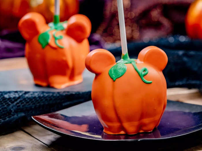 The theme park also introduces festive treats like Mickey-shaped pumpkin apples.