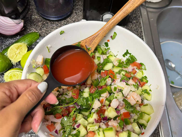 Finally, top the mixture with 1/4 cup of Clamato tomato juice and about a teaspoon of ketchup.