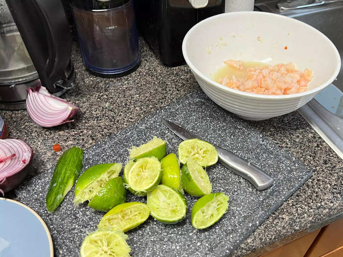 Now, squeeze the 12 limes into the shrimp bowl to marinate the fish.