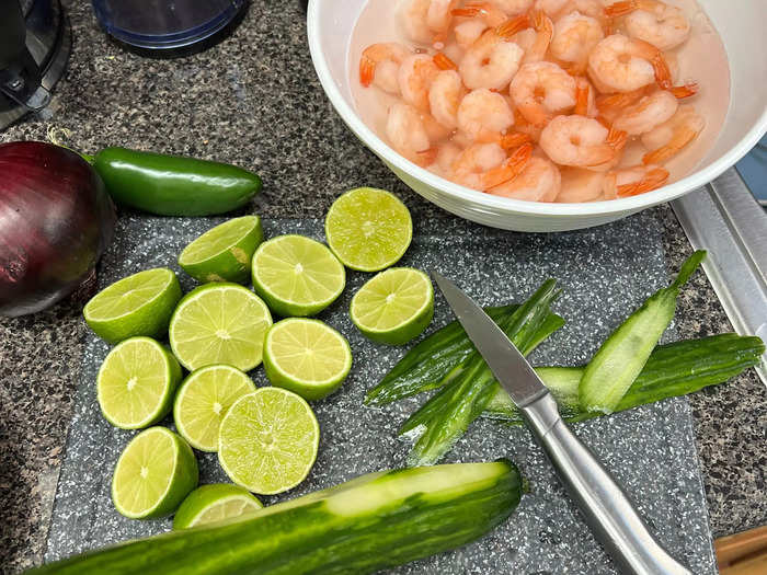 While the shrimp was defrosting, I began chopping 12 limes and peeled the cucumber for the ceviche.