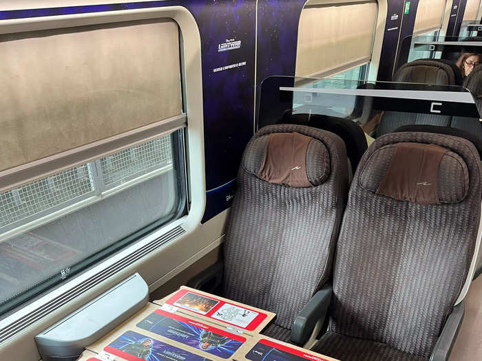 I sat in a backward-facing seat with a table that folded back, providing more legroom. The carriage had a Buzz Lightyear theme, showcasing the movie "Lightyear." Aside from Italian, I didn