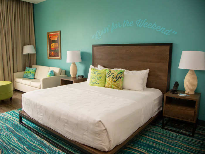 The lyrics printed on the decorative pillows and painted on the wall above the bed pay homage to Buffett