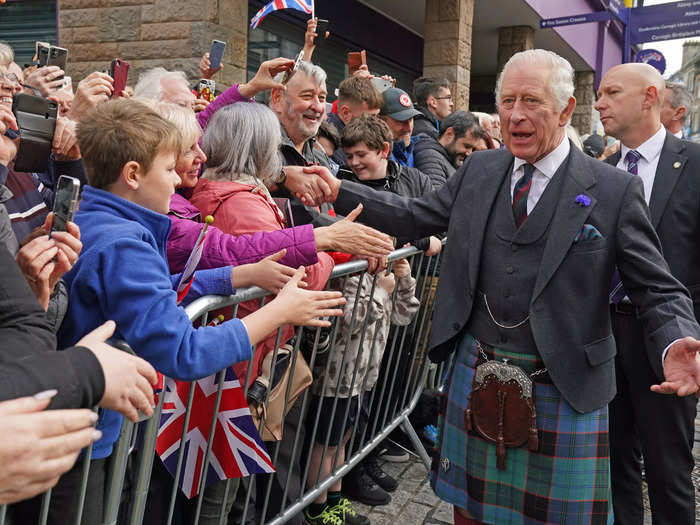 Charles, wearing a kilt, received a welcoming reception from members of the public in his first visit to the city as monarch.