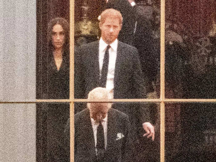 Later that evening, Charles was seen with Prince Harry and Meghan Markle in a rare photo as they waited for the Queen