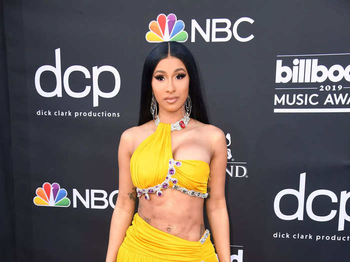 Cardi B channeled Cher in a yellow midriff-baring look at the 2019 Billboard Music Awards.