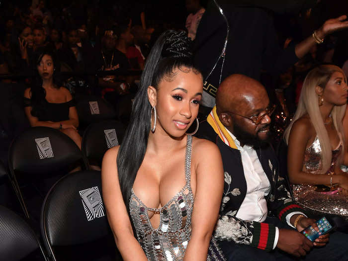 At the BET Hip Hop Awards in 2017, Cardi B wore a low-cut silver dress with sequins.