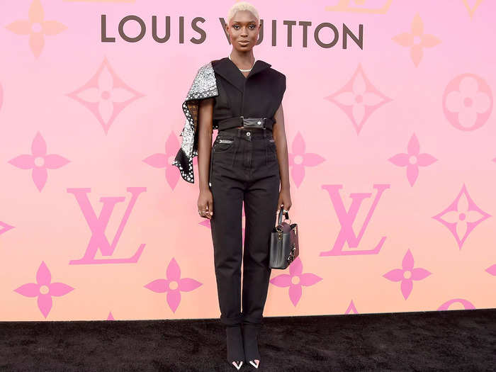 Jodie Turner-Smith attended the Louis Vuitton X experience in June 2019 sporting an asymmetrical vest with an attached sparkle shawl.