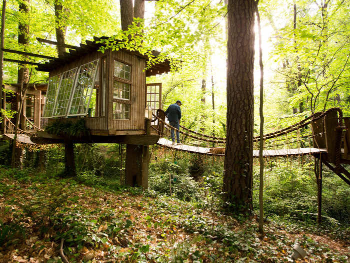 The treehouse consists of three separate rooms — a sitting room, bedroom, and deck — known as the “mind, body, and spirit” that are all connected with rope bridges.