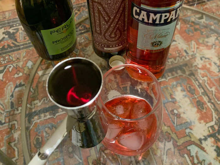 I dropped in an ounce of campari, and an ounce of sweet vermouth.