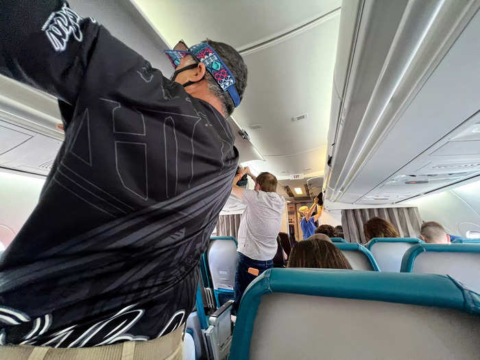 Passengers crowded around the entrance to board the flight.