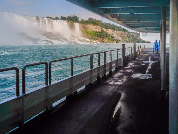 Once I boarded the boat, I realized I had two options: stand on the lower deck, where I would get pretty good views while being partially protected from mist by the roof above ...