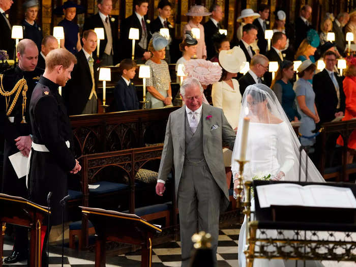 Charles broke royal protocol when he stepped in to escort his future daughter-in-law Meghan Markle down the aisle during her televised wedding to Prince Harry.