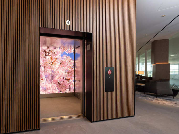 There is also an elevator with a beautiful cherry blossom background that travelers can use.