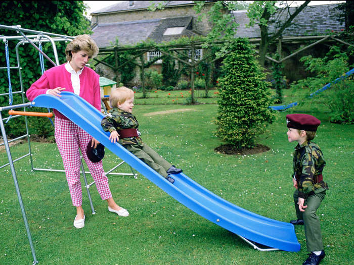 In almost every photo taken of Harry and William playing as children, Diana is nearby.