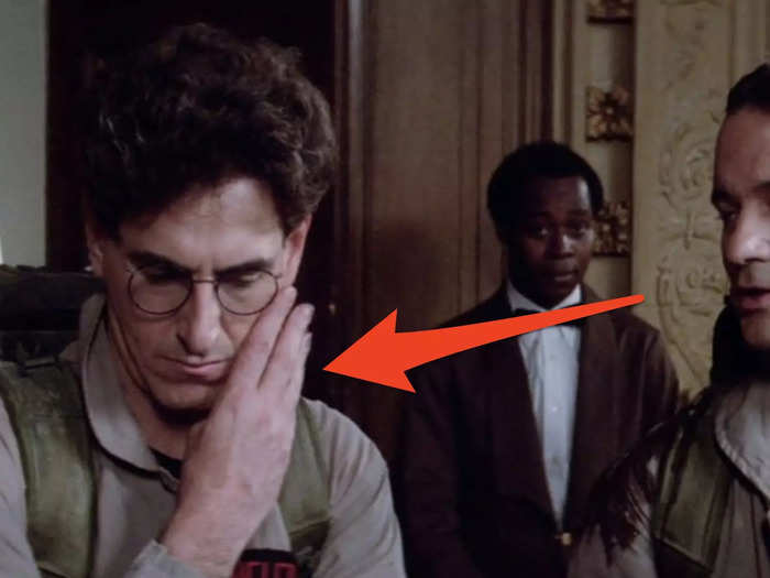 Egon makes a hand gesture to tell Peter what to charge for handling the hotel ghost.