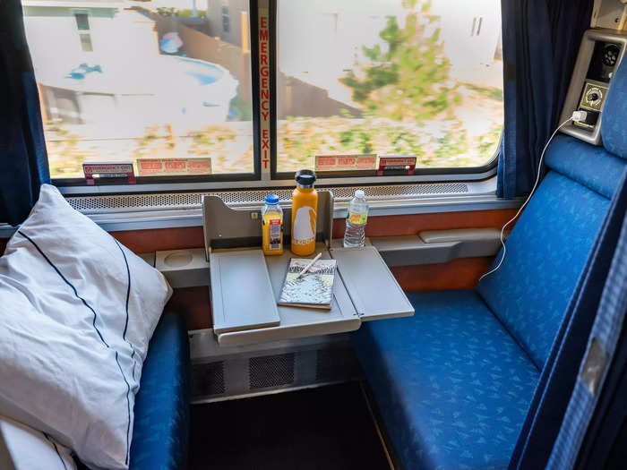 Inside the roomette, two seats faced each other, and there was a small retractable table between them.