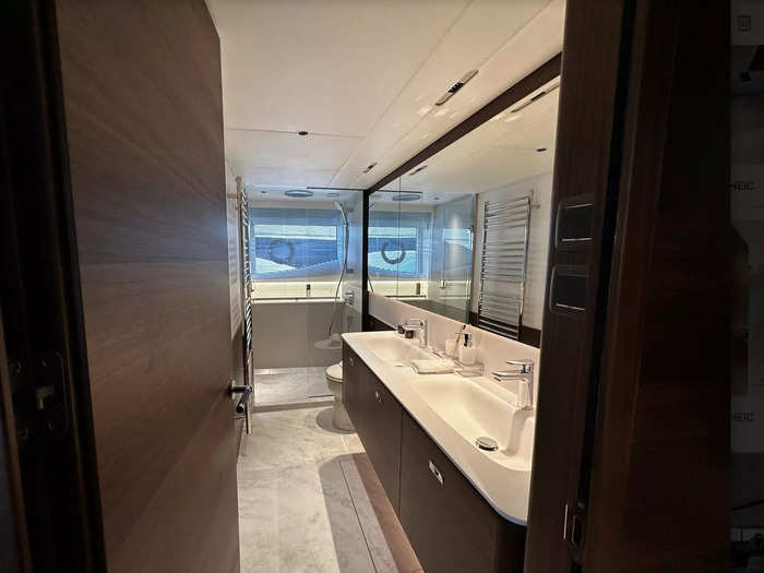 The master bedroom has a rather spacious bathroom, featuring dual sinks and a large shower.