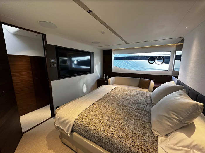 The master has a king-size bed, two-seat sofa, and panoramic windows.