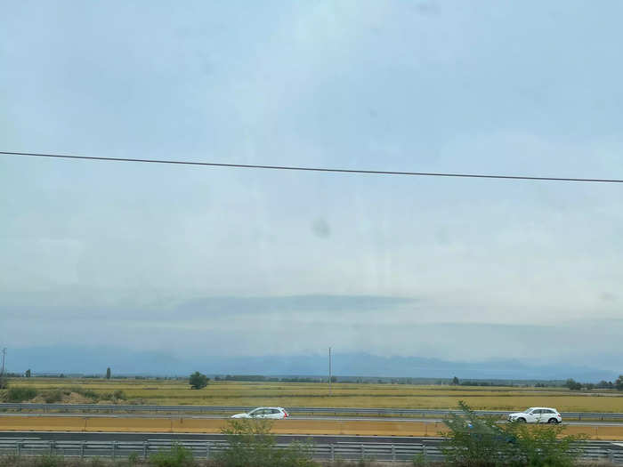 I got to enjoy the nibbles with a view of the Alps, the highest mountain range in Europe, as well as fields and highways.