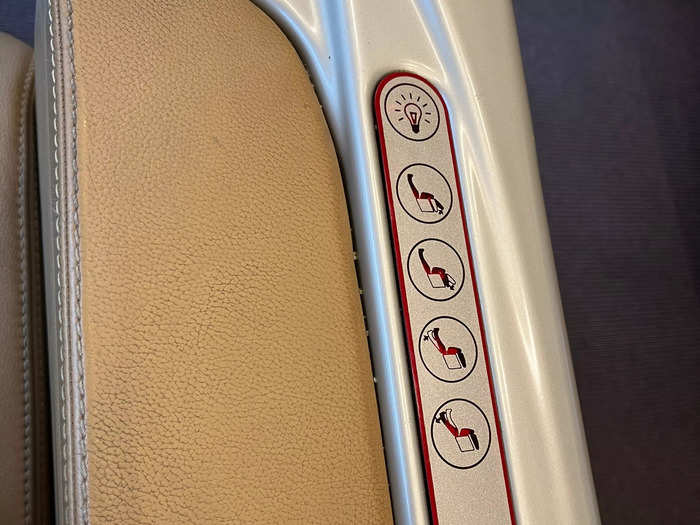 There were buttons on the arm of the chair to control the lights, foot rest, and reclining backrest. Being able to sit back and put my feet up made the first-class experience feel even more luxurious.