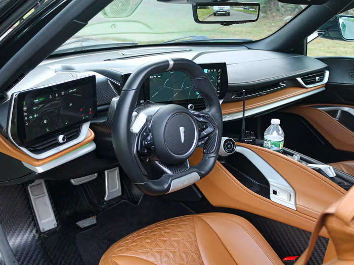 The cabin features an interesting mix of exposed carbon fiber and more refined, high-end materials.