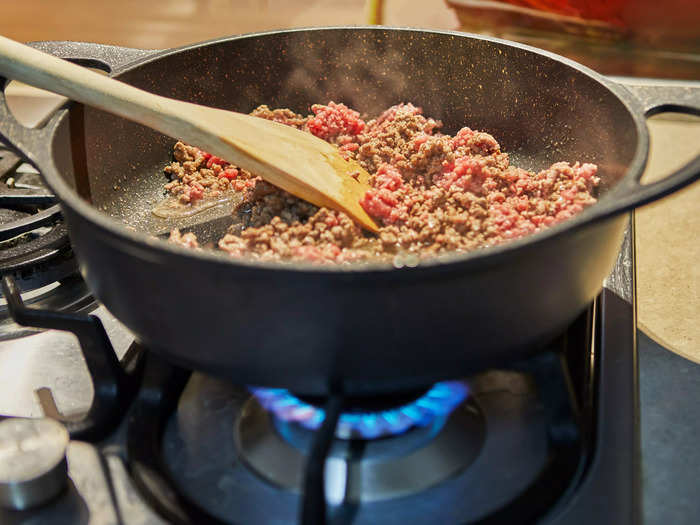 Buy vegetarian chili and add your own meat.