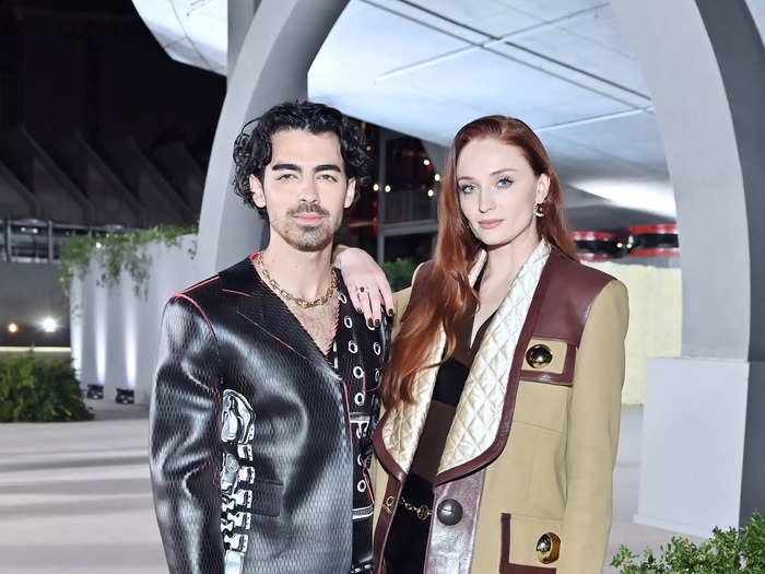 Joe Jonas brought punk to the gala in a printed leather suit while his wife Sophie Turner went for an eclectic ensemble featuring lace tights.