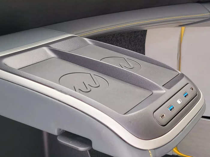 Interior consoles in the front and back rows of the WiFi-enabled air taxi feature mobile device charging docks. There are even cupholders.