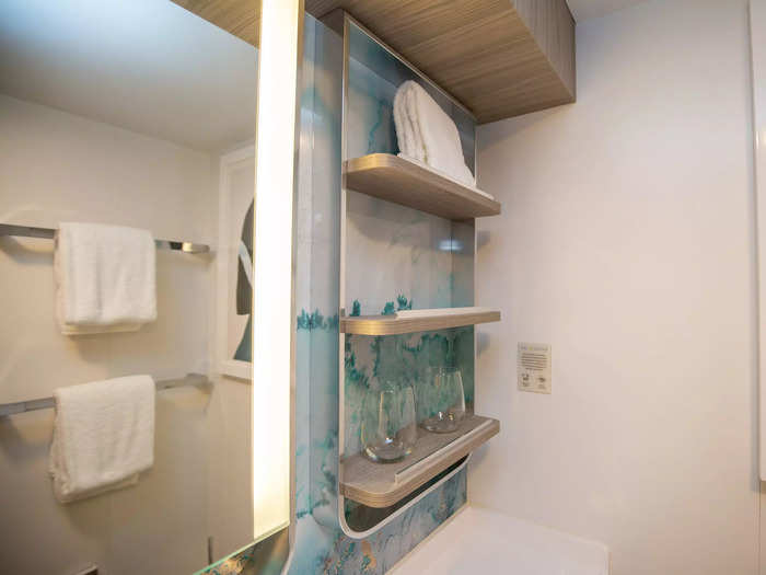 Inside, it was modern and clean with a light-accented mirror and shelves that provided ample storage for my toiletries.