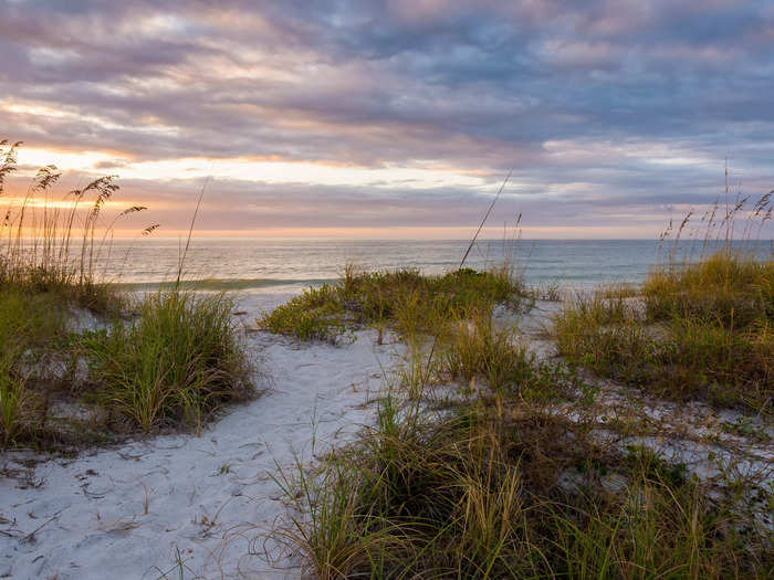 Lastly, I see visitors walking on sand dunes, but it