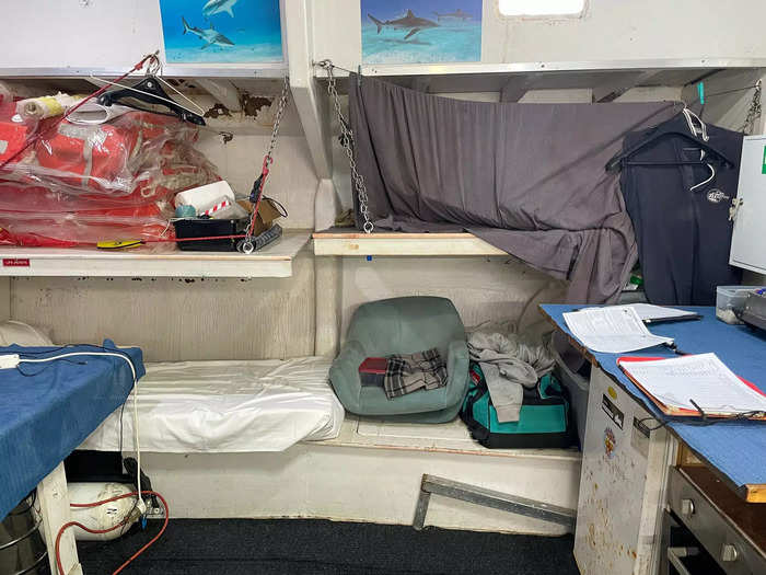 Across from the kitchen were more bunk beds. Two were used for sleeping and two had been transformed into storage for life jackets and personal belongings.