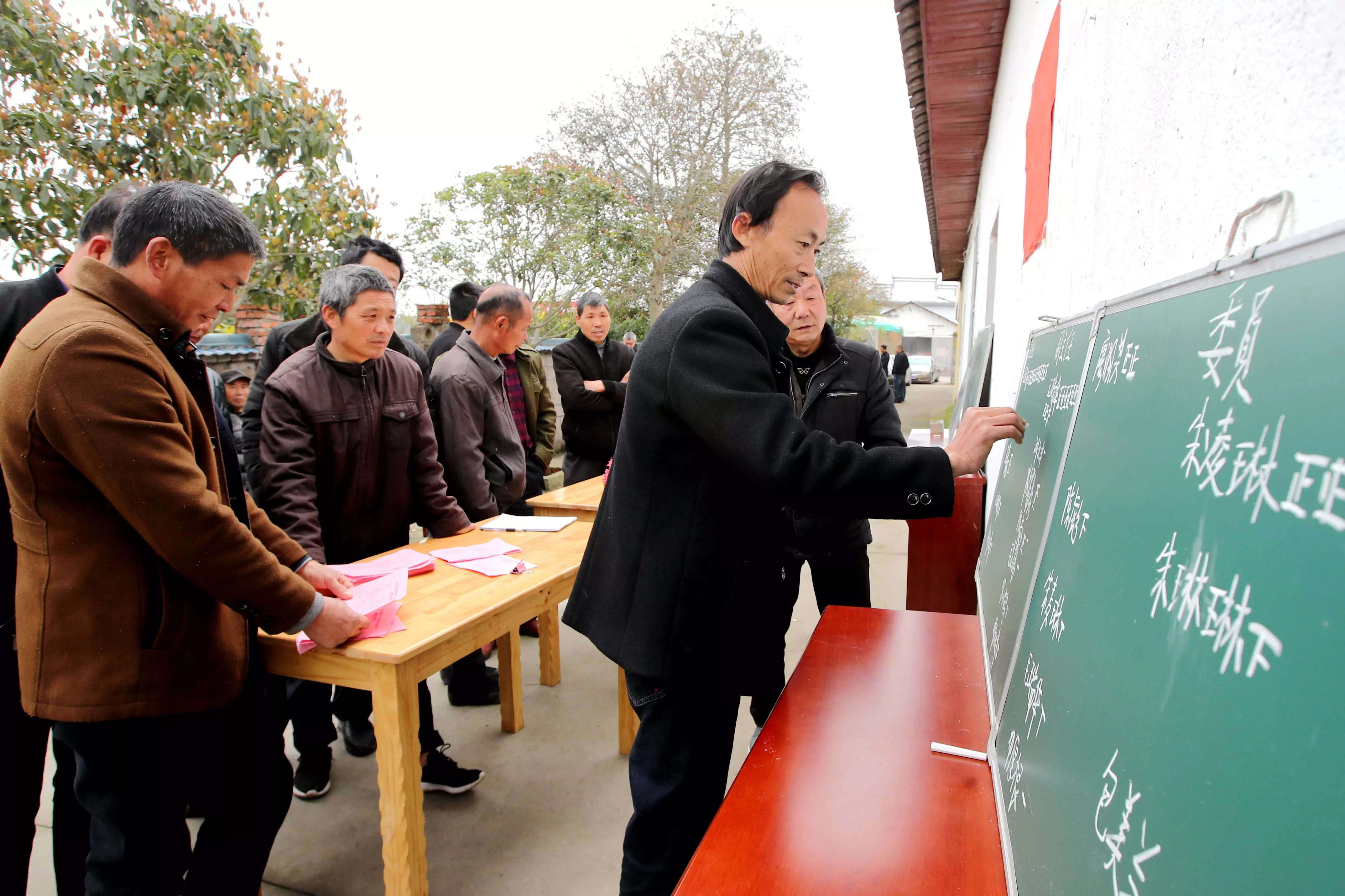 Workers count ballots during a village committee election at Geping village on March 4, 2021 in Xiajiang County, Jiangxi Province of China.