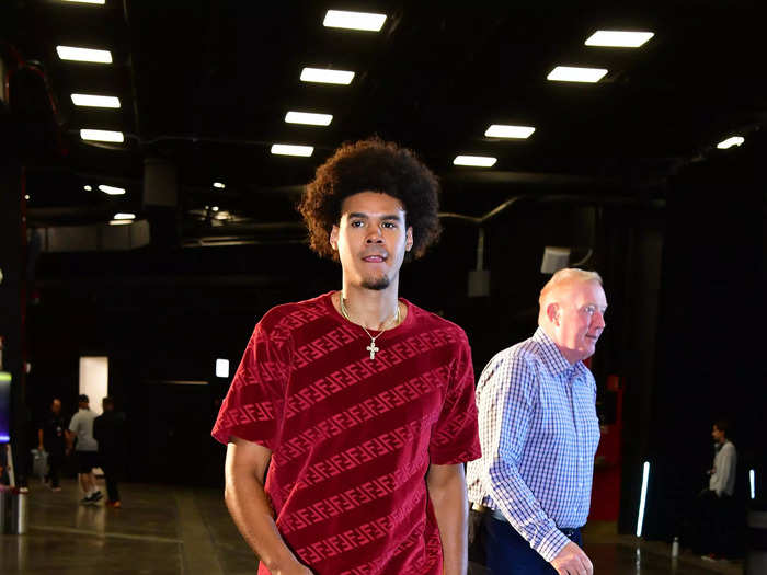 Suns forward Cameron Johnson duds in a red Fendi outfit.