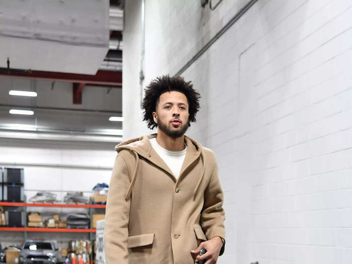 Cade Cunningham goes monochrome in a hoodie-coat.