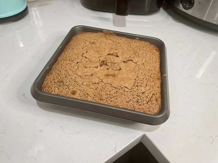 Put the slutty brownie mix into the oven and let it bake.