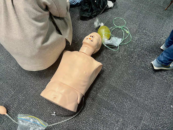 On the day we visited, we saw trainees practicing CPR in groups of three — one doing compressions, one on the resuscitator mask, and one on the defibrillator.