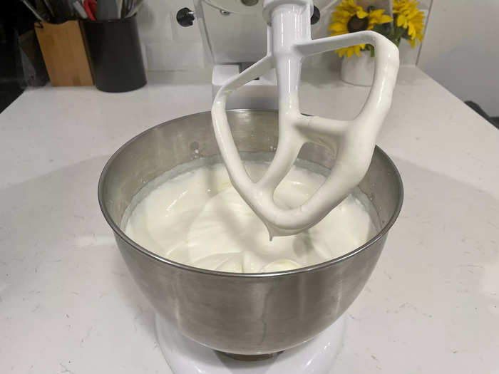 After 10 minutes, the heavy cream began to thicken and cling to the flat beater attachment.