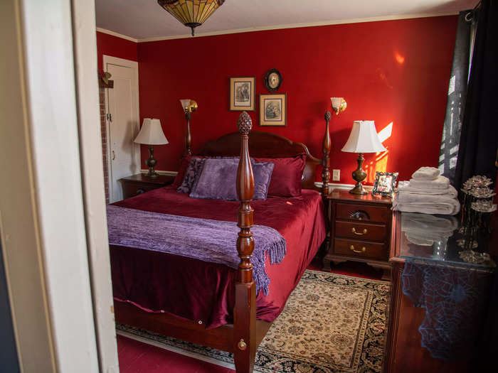 I walked into the next bedroom on the second floor and immediately fell in love with the deep red color of the walls. Out of all the bedrooms, Marchand said the red one is most guests