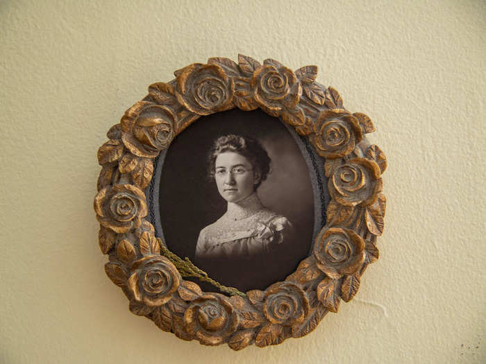 The vintage photographs made the house feel like it was frozen in colonial times when it was built.