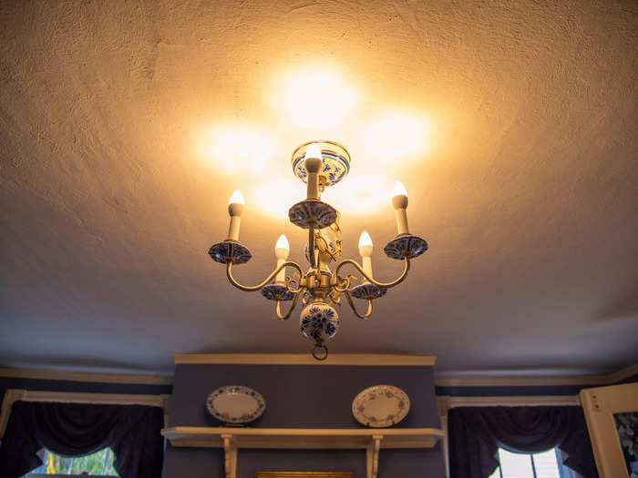 A chandelier hung from the ceiling directly over the table.